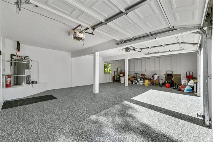 Garage with third space for car or large work bench/storage area.