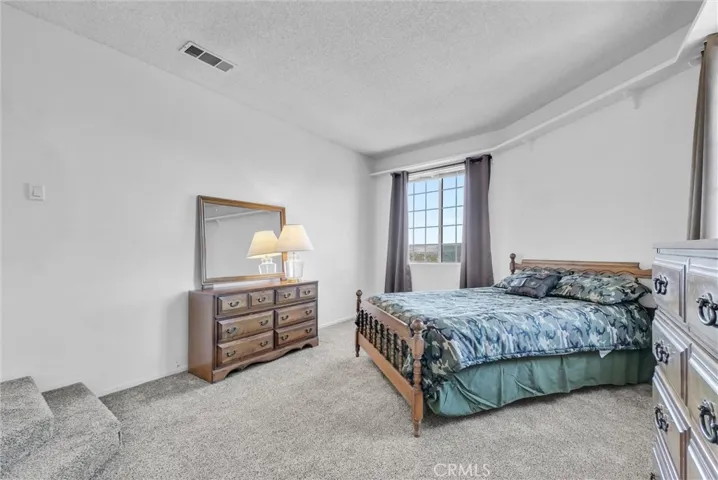 Step down into this bedroom.