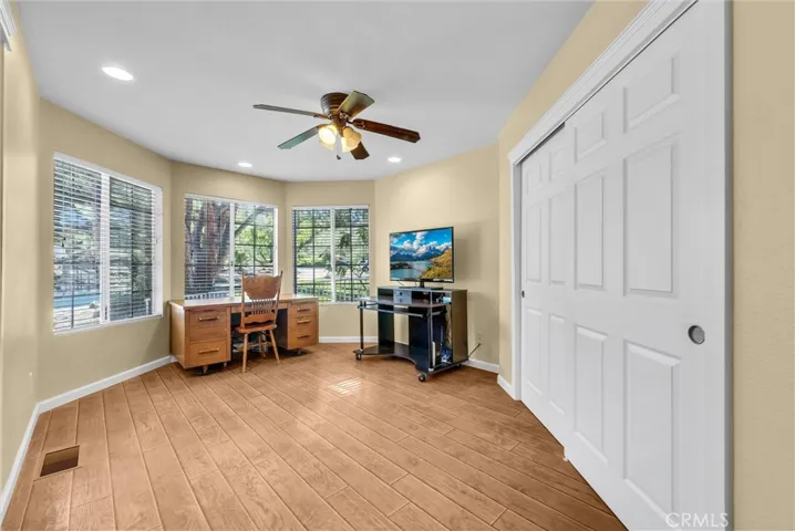 Bedroom one.    Beautiful Pergo wood flooring.  Currently used as an office.
