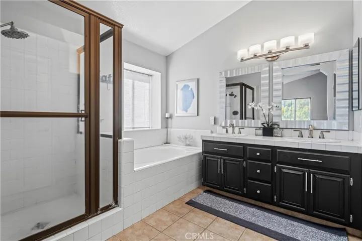 A generous dual-sink vanity offers plenty of space for busy mornings.