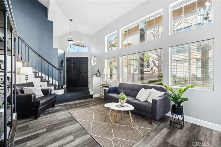 Tall windows and open space make this living area feel bright and expansive.