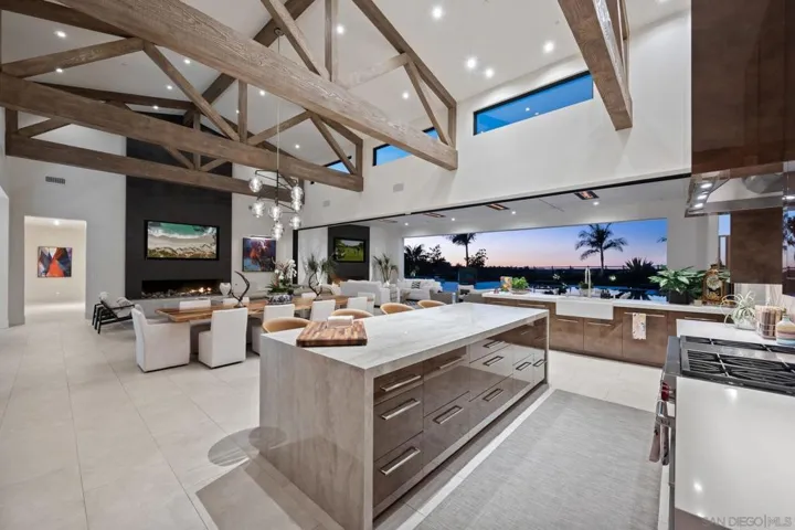 Great room of main home with motorized glass wall in the pocket.