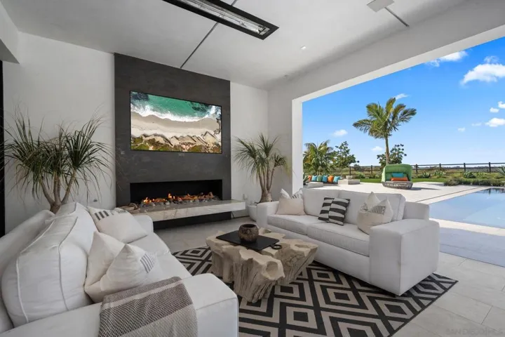 Incredible outdoor living room with flush mount ceiling heaters for year around use.