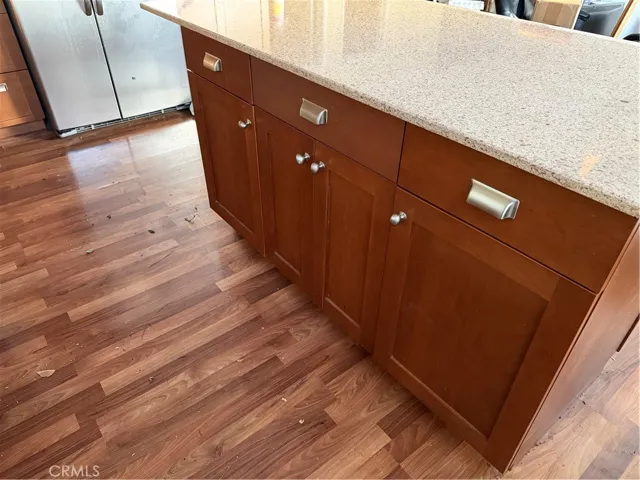 Cabinets below breakfast bar