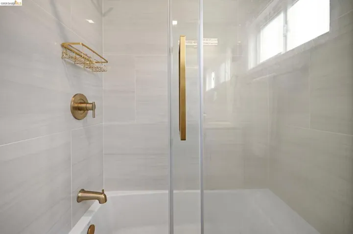 Bathroom featuring a tile shower