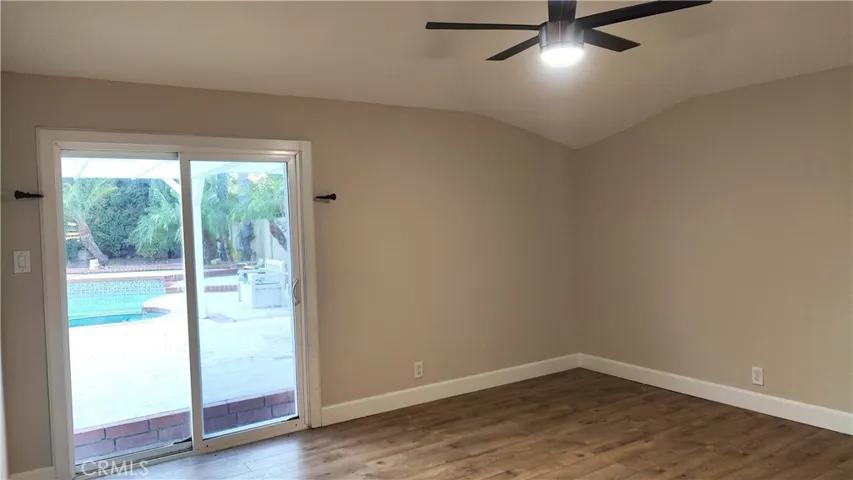 Master Bedroom with patio door to backyard and view of pool