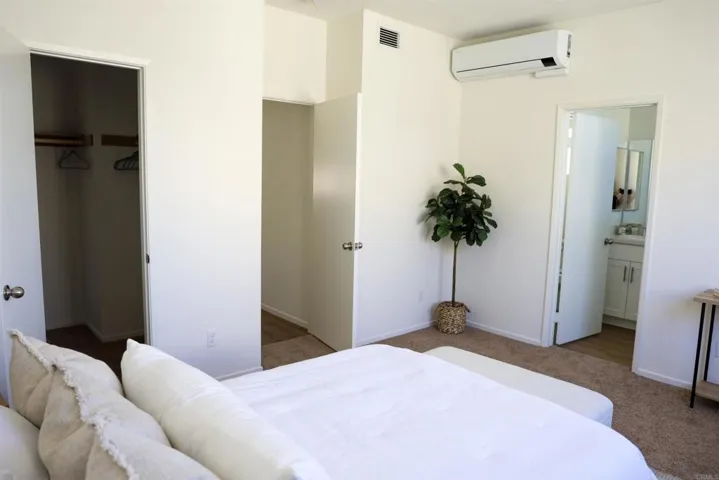 Primary bedroom with ensuite bathroom access and walk-in closet.