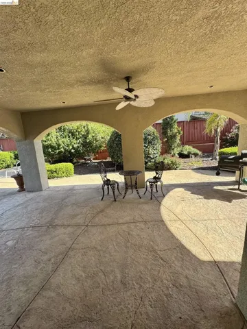 Covered patio featuring a textured ceiling, recessed lighting, and an overhead ceiling fan