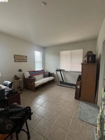 Living room with light tile patterned floors