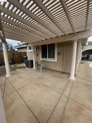 View of patio / terrace featuring a pergola and a gate