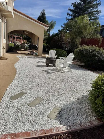 View of yard with a patio area and a ceiling fan