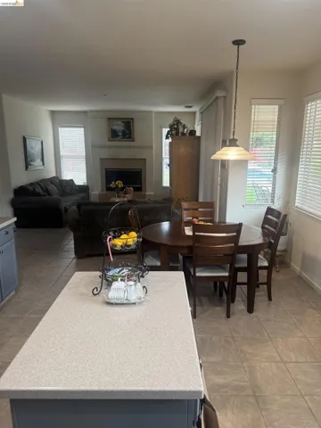 Dining area with healthy amount of natural light and a fireplace