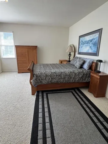 Wall-to-wall carpeting with a light neutral tone