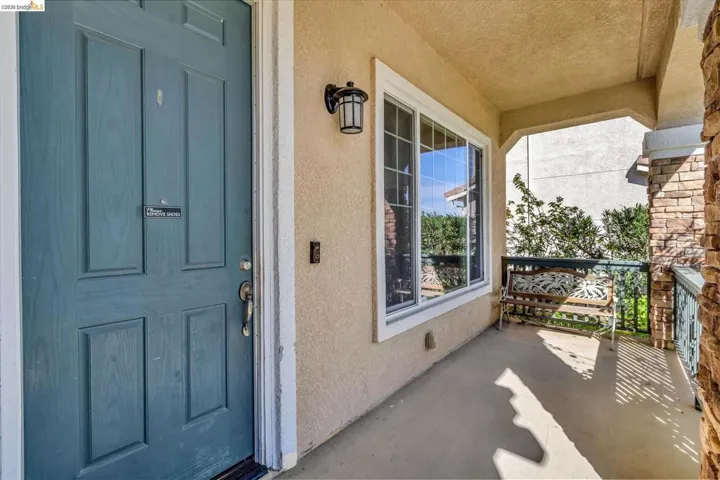 View of exterior entry with stucco siding