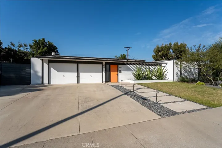 Two-car side-by-side garage. Ample driveway and curb space