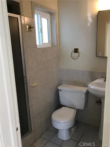 3/4 bathroom behind dining room area