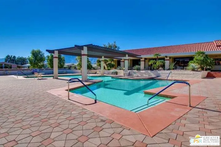 Brick walkway around pool