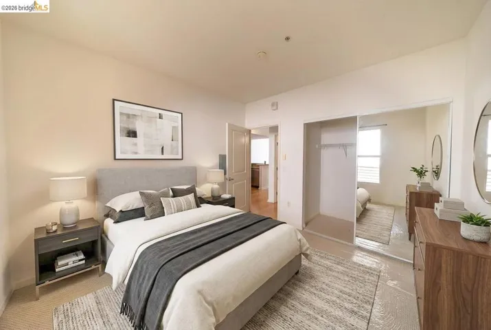 Carpeted bedroom featuring a closet and baseboards
