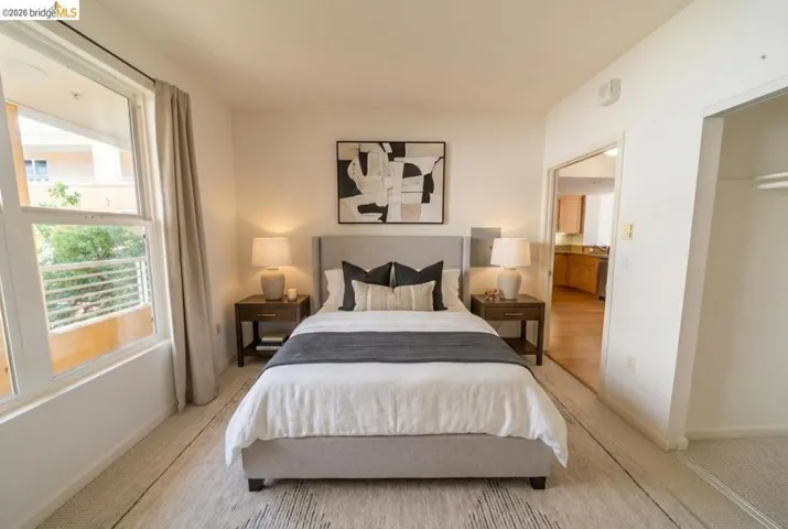 Bedroom featuring carpet floors and baseboards