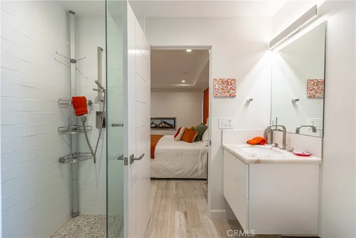 Bathroom #4 with Walk-in Shower. Door opens up to the Primary Bedroom as well.