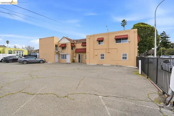 view of building exterior with uncovered parking