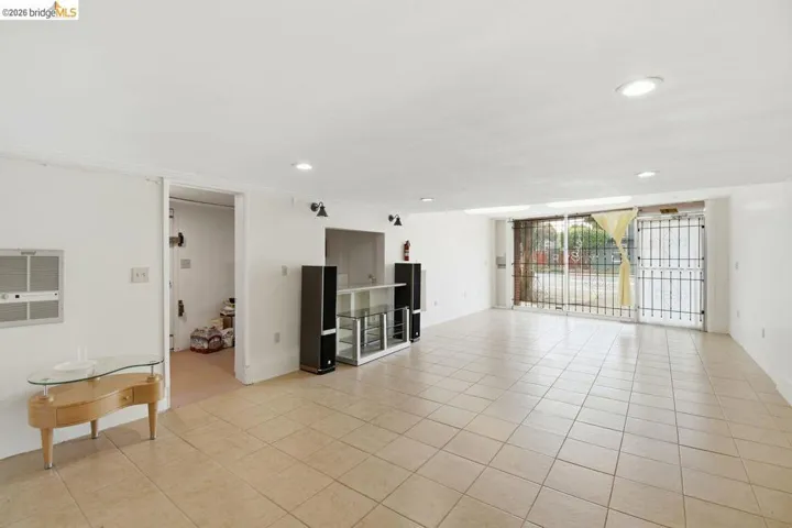 unfurnished living room with recessed lighting and light tile patterned floors