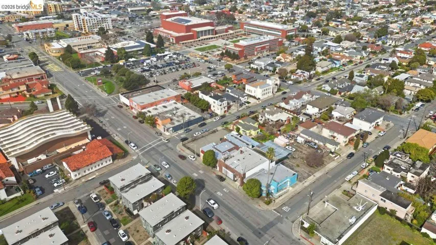 aerial view of property and surrounding area with nearby urban area