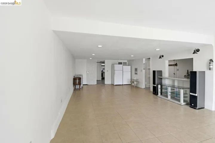 unfurnished living room featuring recessed lighting and light tile patterned floors