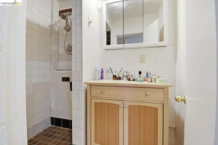 bathroom with vanity and a shower stall