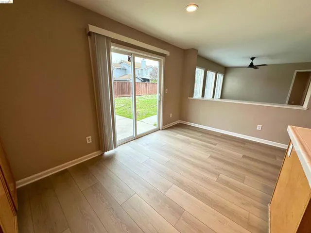 Unfurnished room featuring light wood-style floors, ceiling fan, and recessed lighting