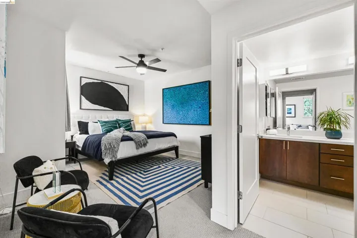 Bedroom with ceiling fan and light tile patterned floors
