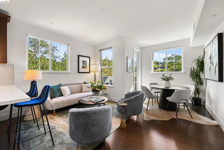 Living area with hardwood / wood-style flooring and baseboards