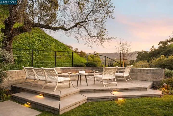 Seating area around fire pit with views