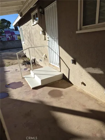 Door Access to Back Yard with steps.