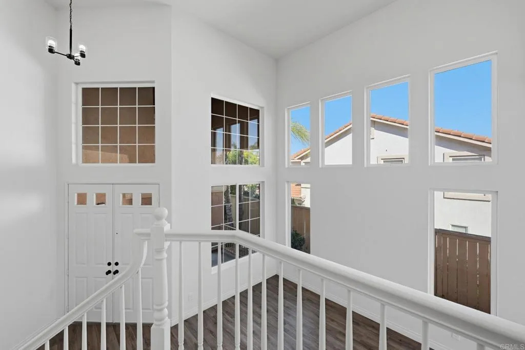 Upstairs there is a charming landing where you can look down into the dramatic atrium living area.