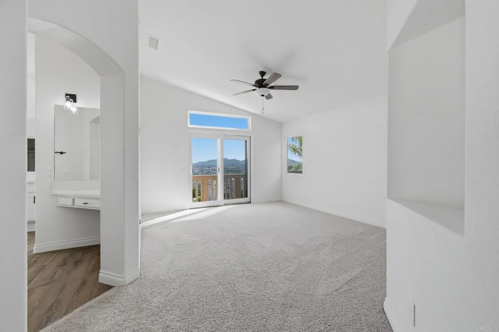 Freshly remodeled primary bedroom has sliding doors leading to upper view balcony for morning cafe!