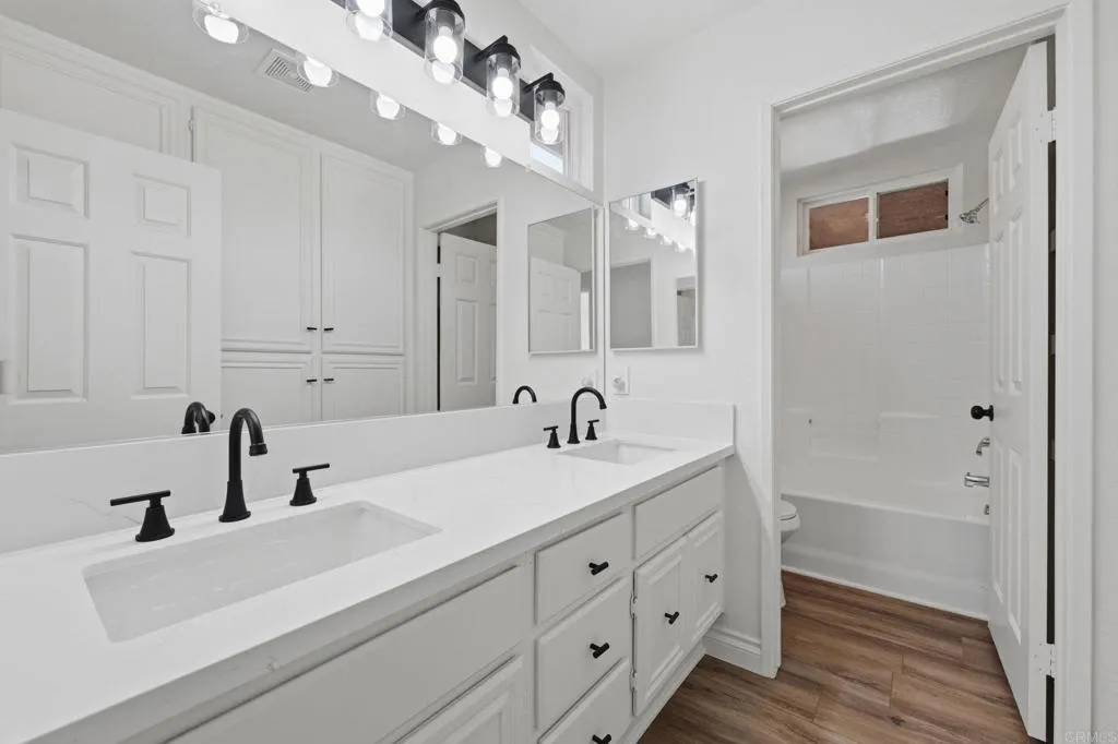 Two hall bedrooms share hall bath.