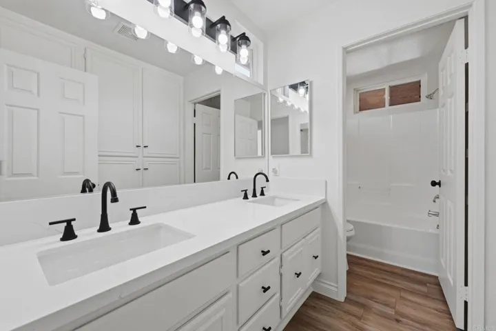 Two hall bedrooms share hall bath.