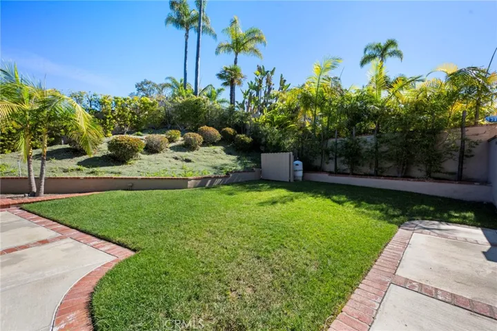 Large grass area next to pool for lots of fun