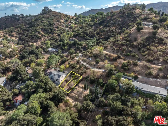 Lot on left next to structure