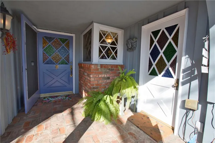 Covered front porch entry into the home and attached, direct access garage.
