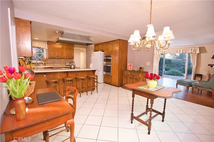 Dining room view to living room, kitchen and breakfast counter