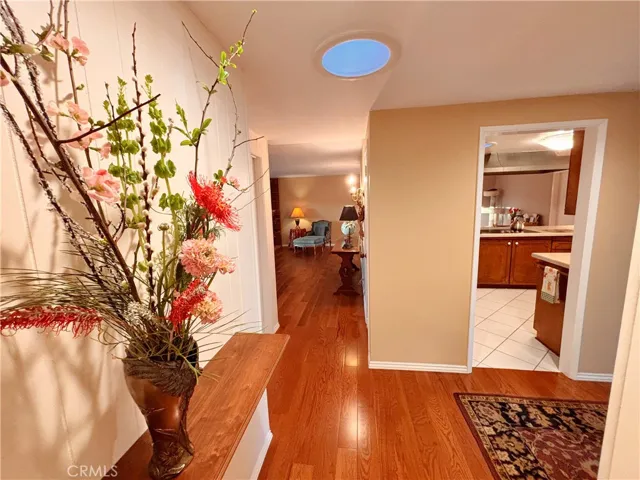 Hall and entry views to kitchen and living room