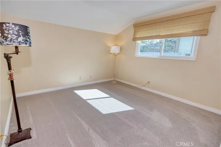 This secondary bedroom with coved ceiling faces south for all day sun