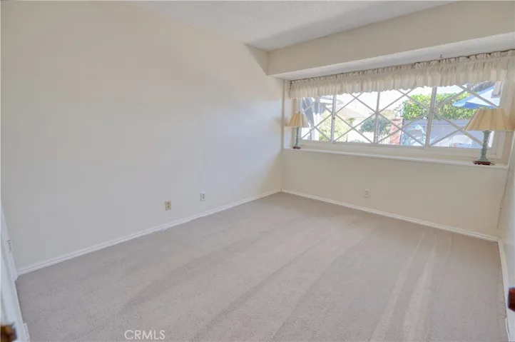 This front bedroom enjoys the morning sun