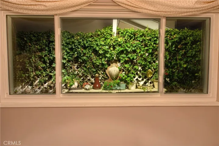 Night time dining room window view to the side yard