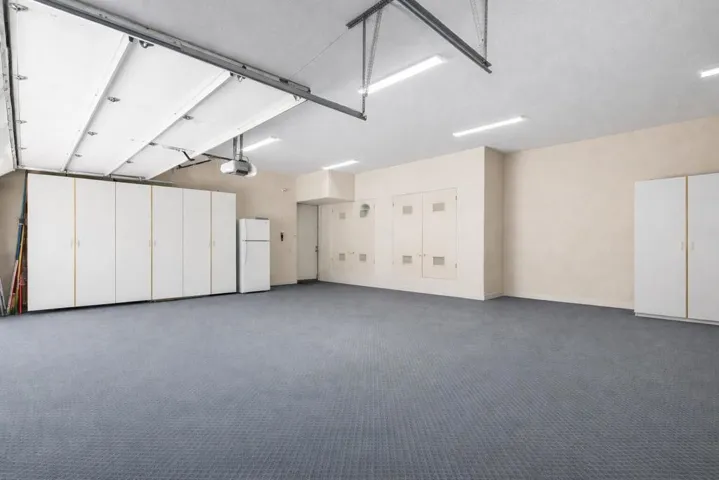 Spacious garage with sleek storage featu