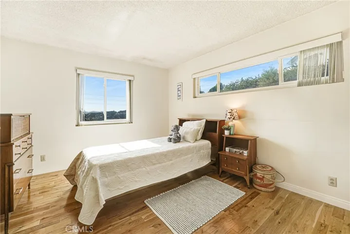 Upstairs bedroom with peek-a-boo ocean view
