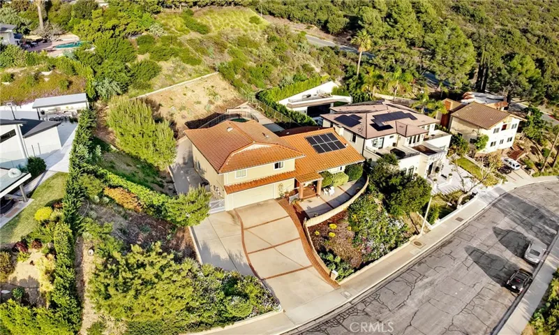 Aerial Photo showing how this amazing wide lot has a drive way up into the back of the property.