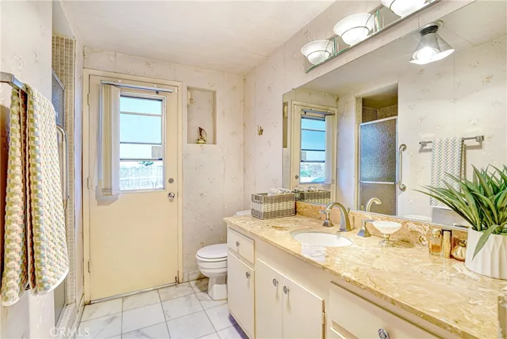 Downstairs bathroom also opens to pool area.